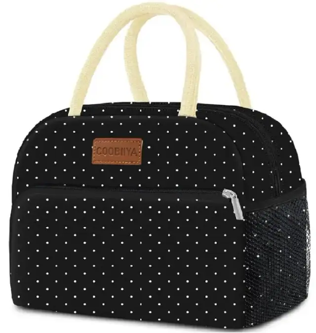 Coobiiya black lunch tote with small white polka dots, light handles and a side mesh pocket